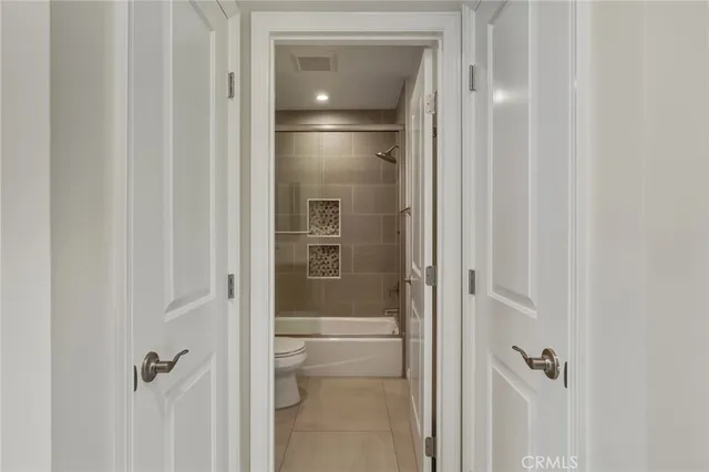 a bathroom with a glass shower door