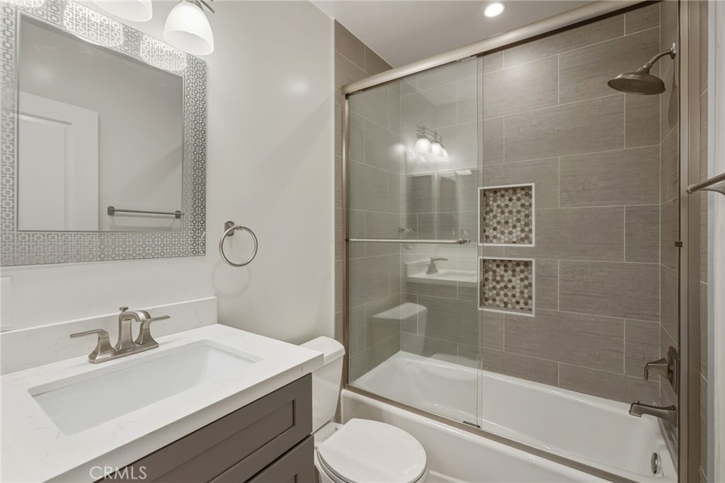 6017 Encino Encino, CA 91316 - Photo 34 of 51 a bathroom with a sink toilet and shower