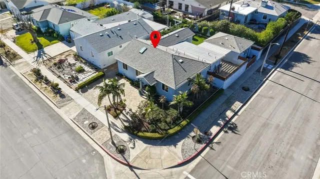 an aerial view of a house with a swimming pool