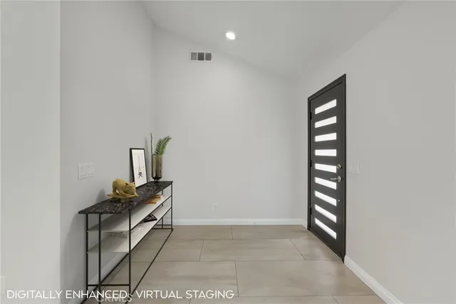 a view of an empty room with windows