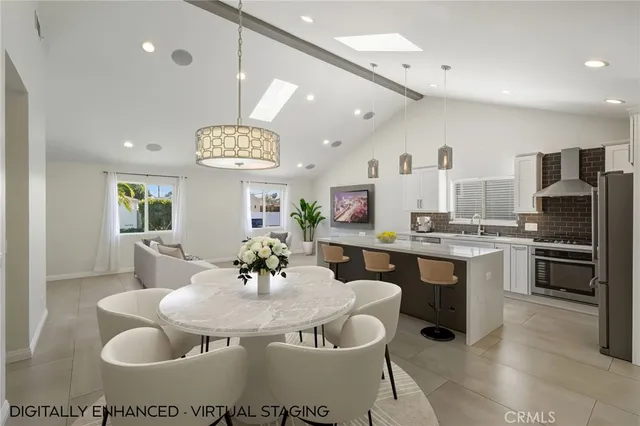 a kitchen with a dining table and chairs