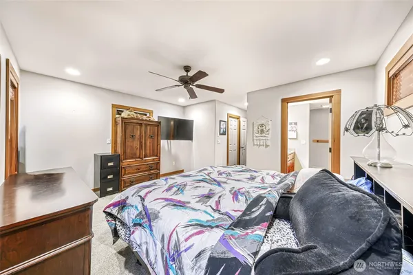 a bed room with a bed and a tv