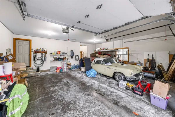a view of a garage with parked cars