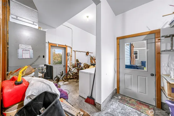 a bedroom with furniture and a window