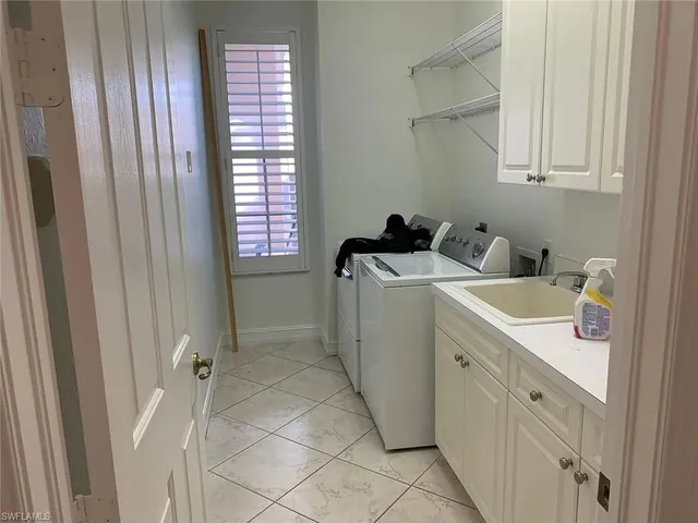 a kitchen with stainless steel appliances granite countertop a refrigerator and a stove