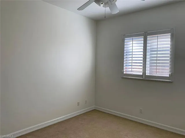 a bathroom with a granite countertop sink and mirror