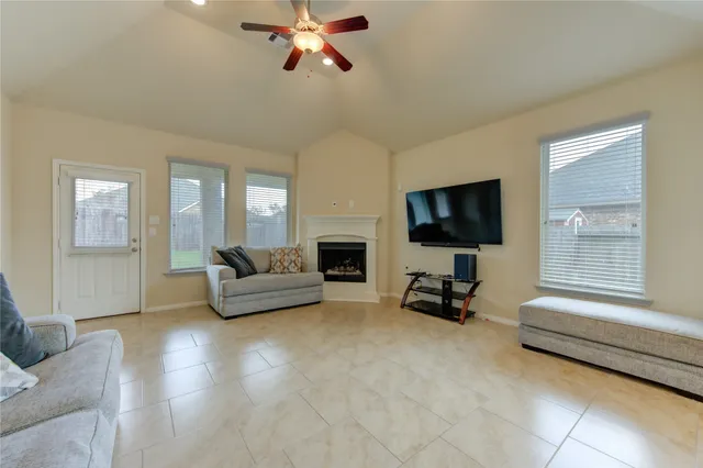 a living room with furniture and a flat screen tv