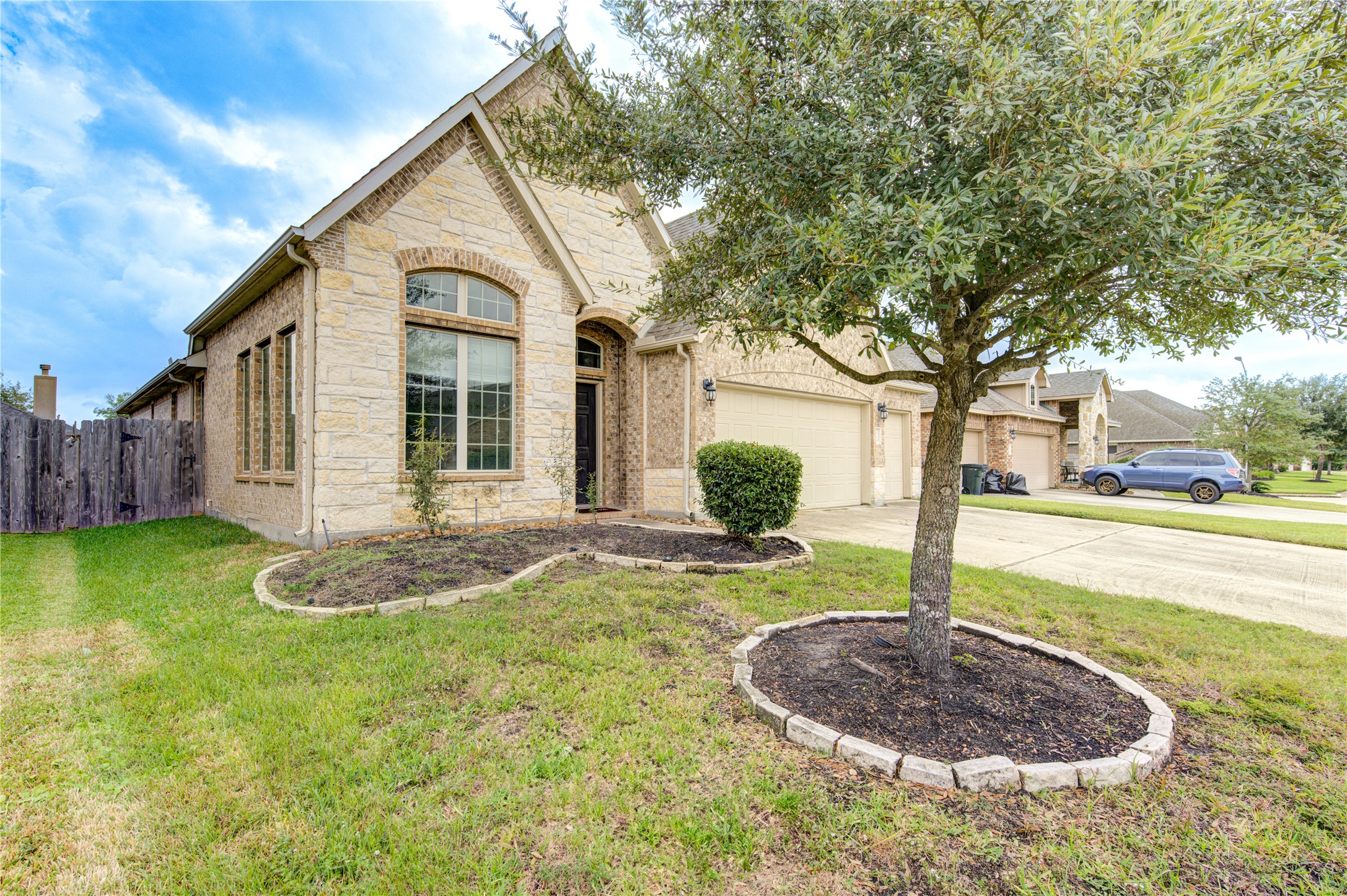 18106 Dorman Draw Lane Houston, TX 77044 - Photo 2 of 27 a front view of a house with garden