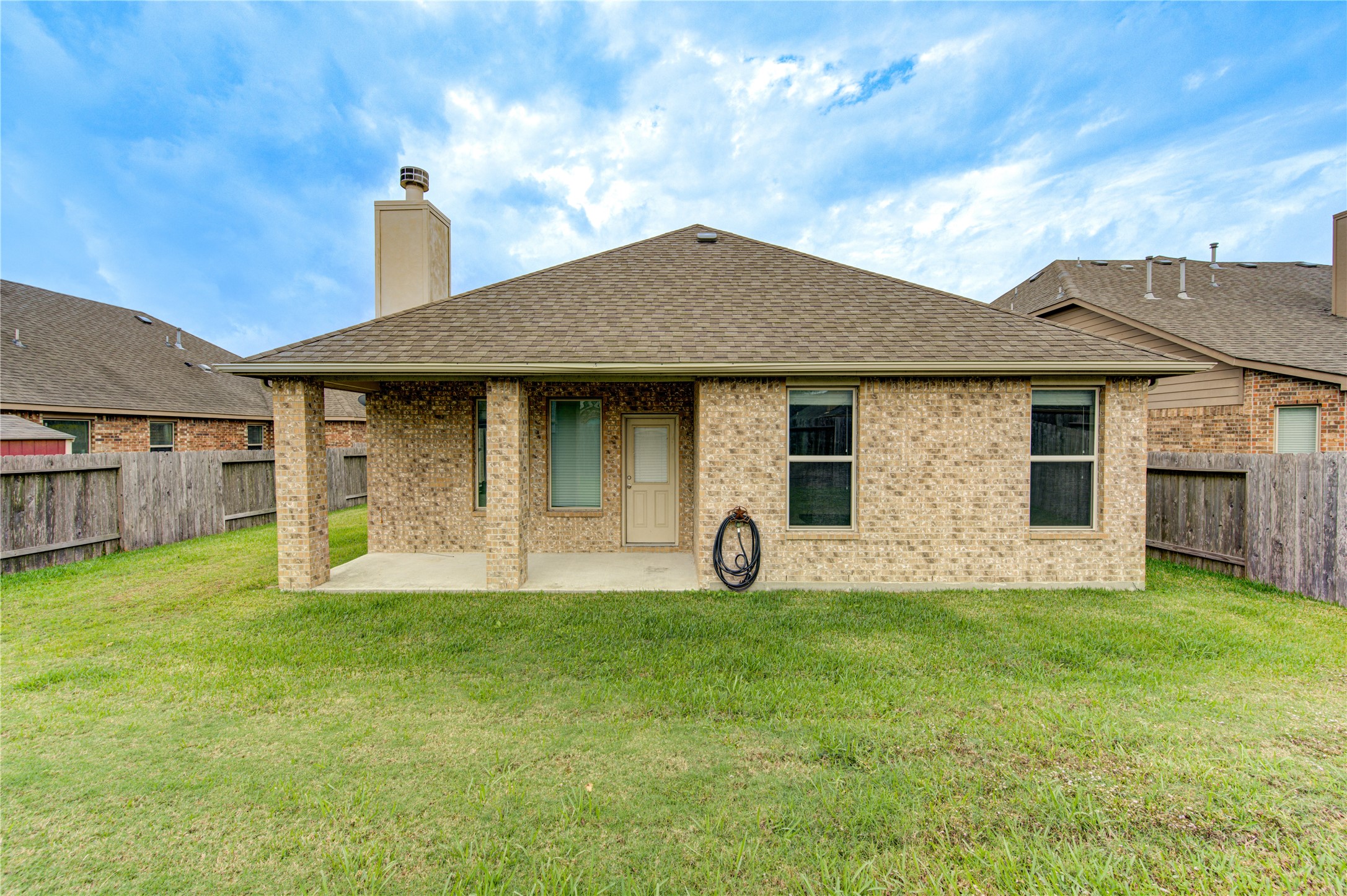18106 Dorman Draw Lane Houston, TX 77044 - Photo 26 of 27 a front view of a house with a yard