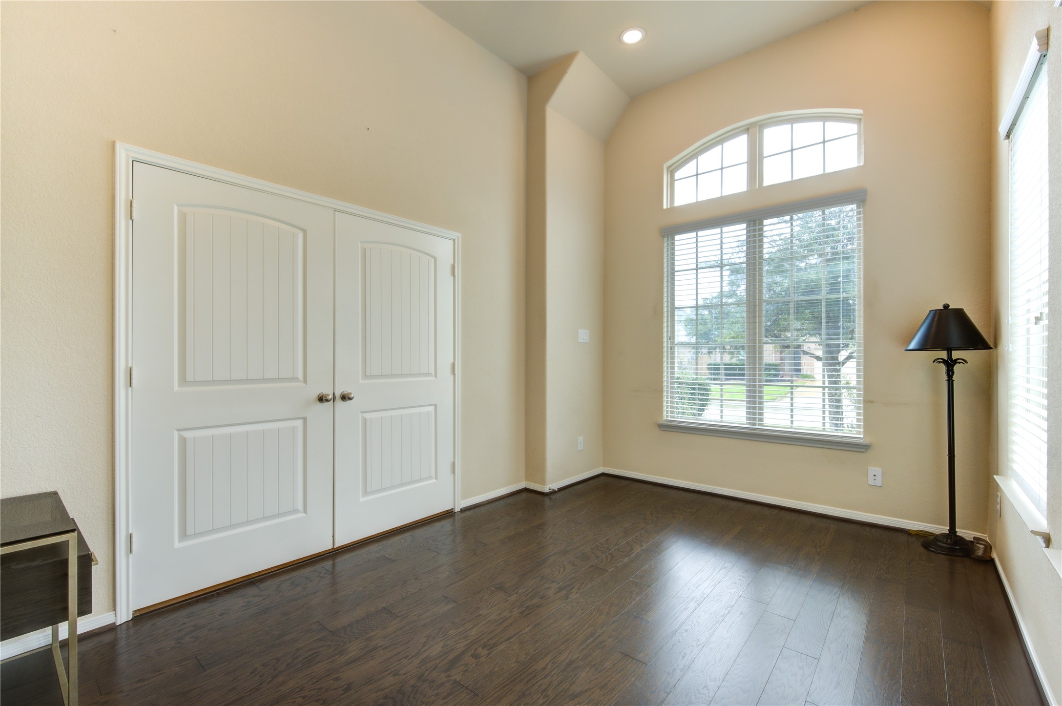 18106 Dorman Draw Lane Houston, TX 77044 - Photo 5 of 27 an empty room with wooden floor and windows
