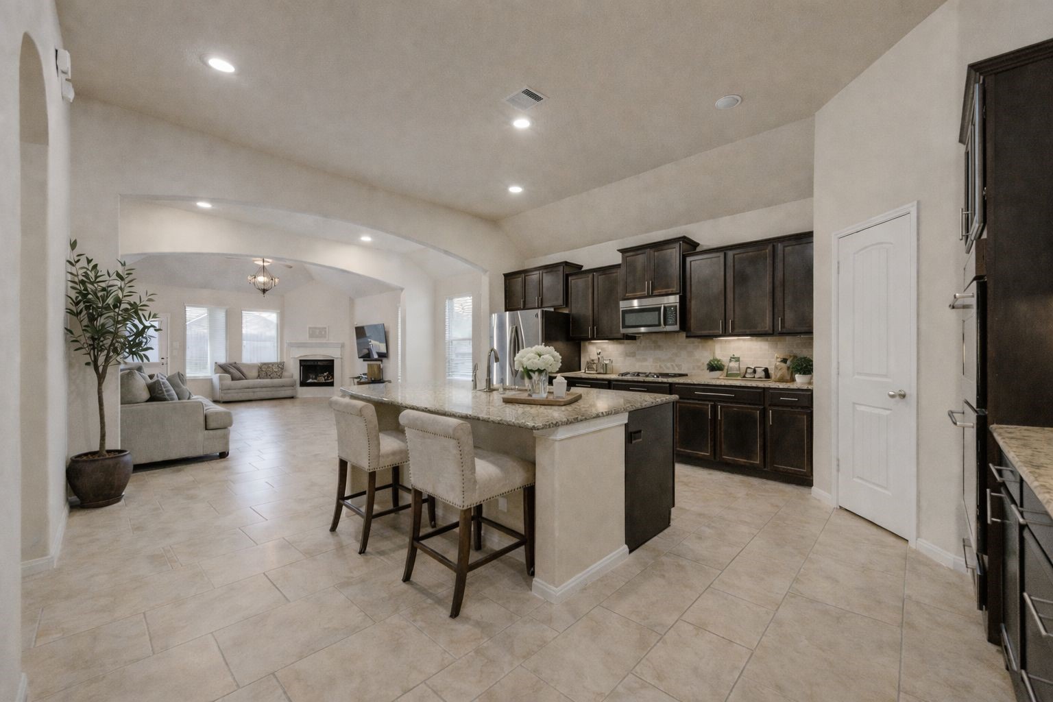 18106 Dorman Draw Lane Houston, TX 77044 - Photo 7 of 27 a kitchen with refrigerator and cabinets