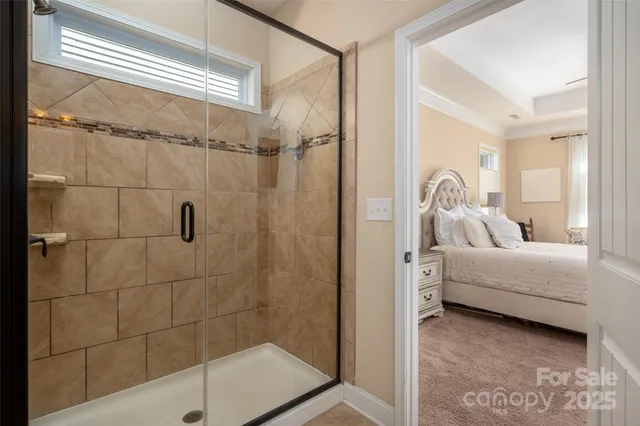 a bathroom with a tub shower and sink