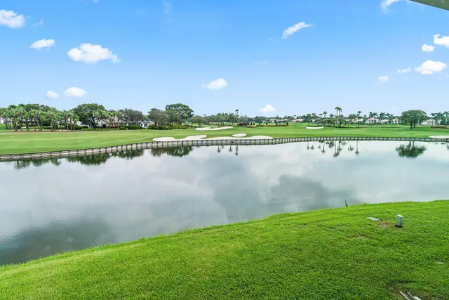 a view of a lake with houses in the background