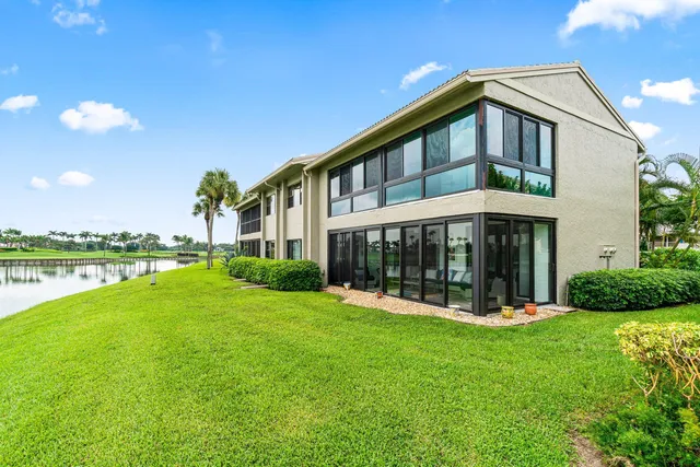 a front view of a house with a yard table and chairs