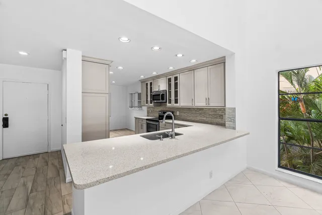 a bathroom with a sink a vanity and a mirror