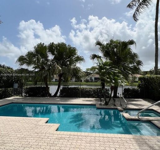 a view of a swimming pool with lounge chair