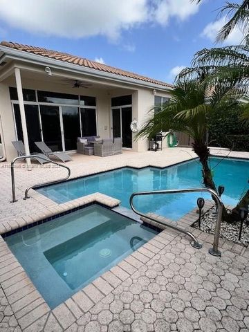 a large bathroom with a granite countertop double vanity sink and a mirror