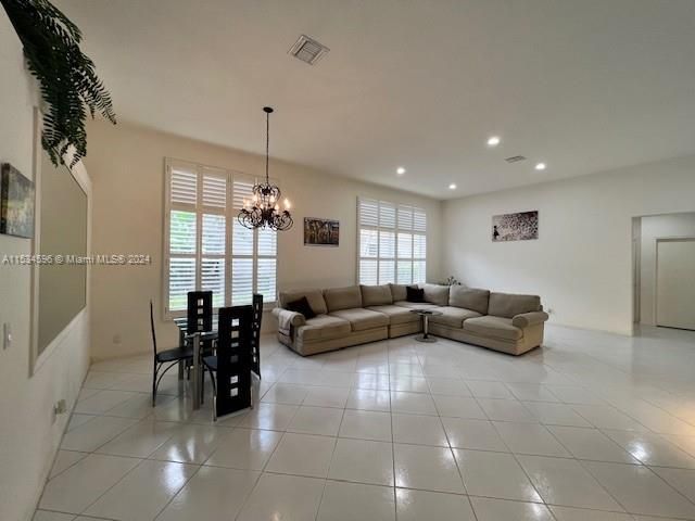a kitchen with refrigerator a microwave a stove and cabinets
