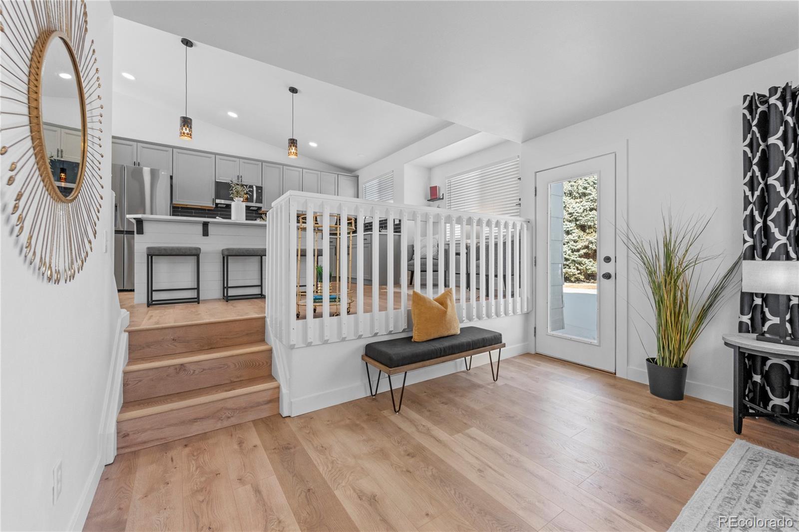 4865 Apollo Bay Drive Highlands Ranch, CO 80130 - Photo 18 of 38 a living room with furniture and a rug