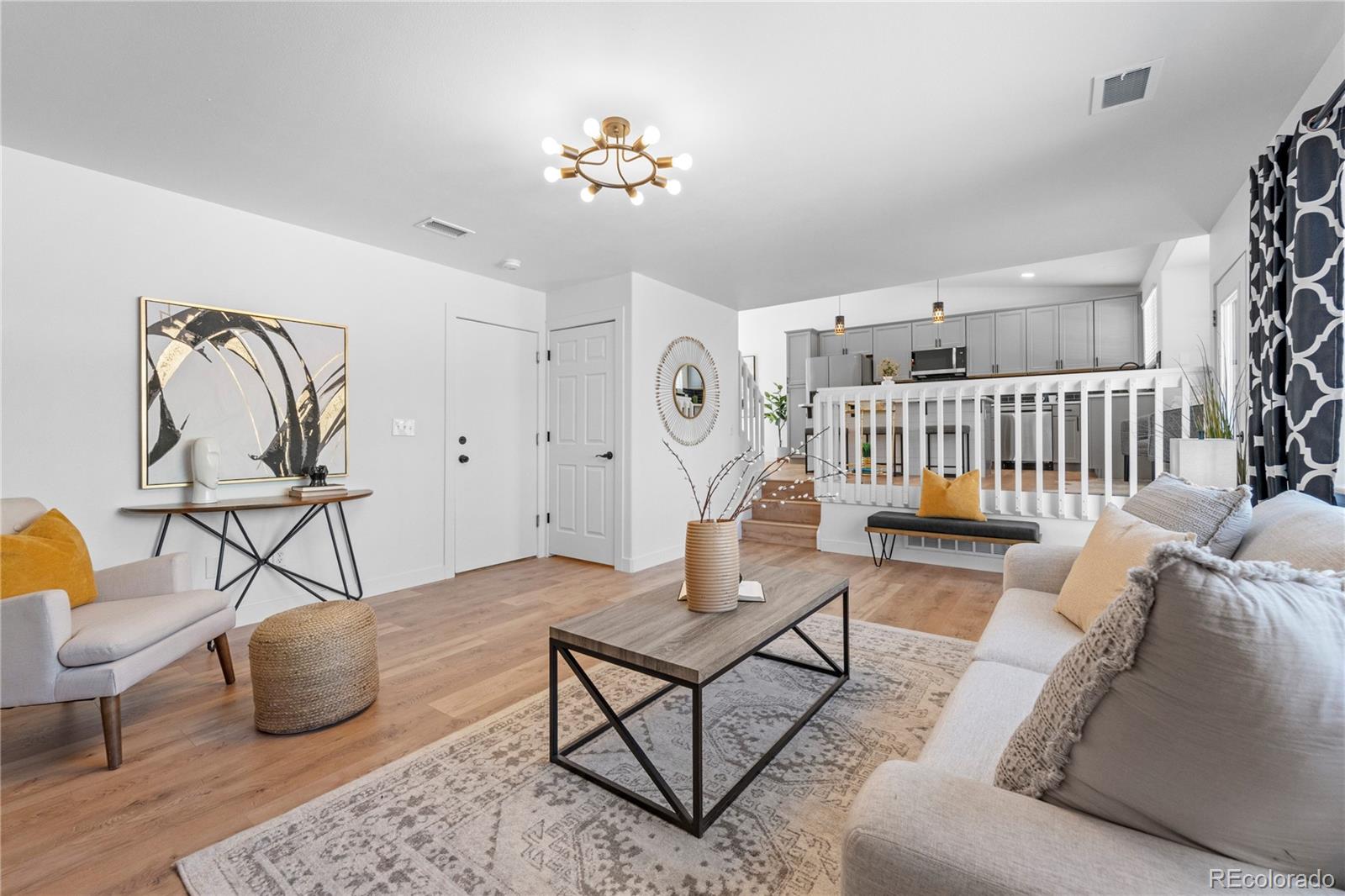 4865 Apollo Bay Drive Highlands Ranch, CO 80130 - Photo 19 of 38 a living room with furniture and wooden floor