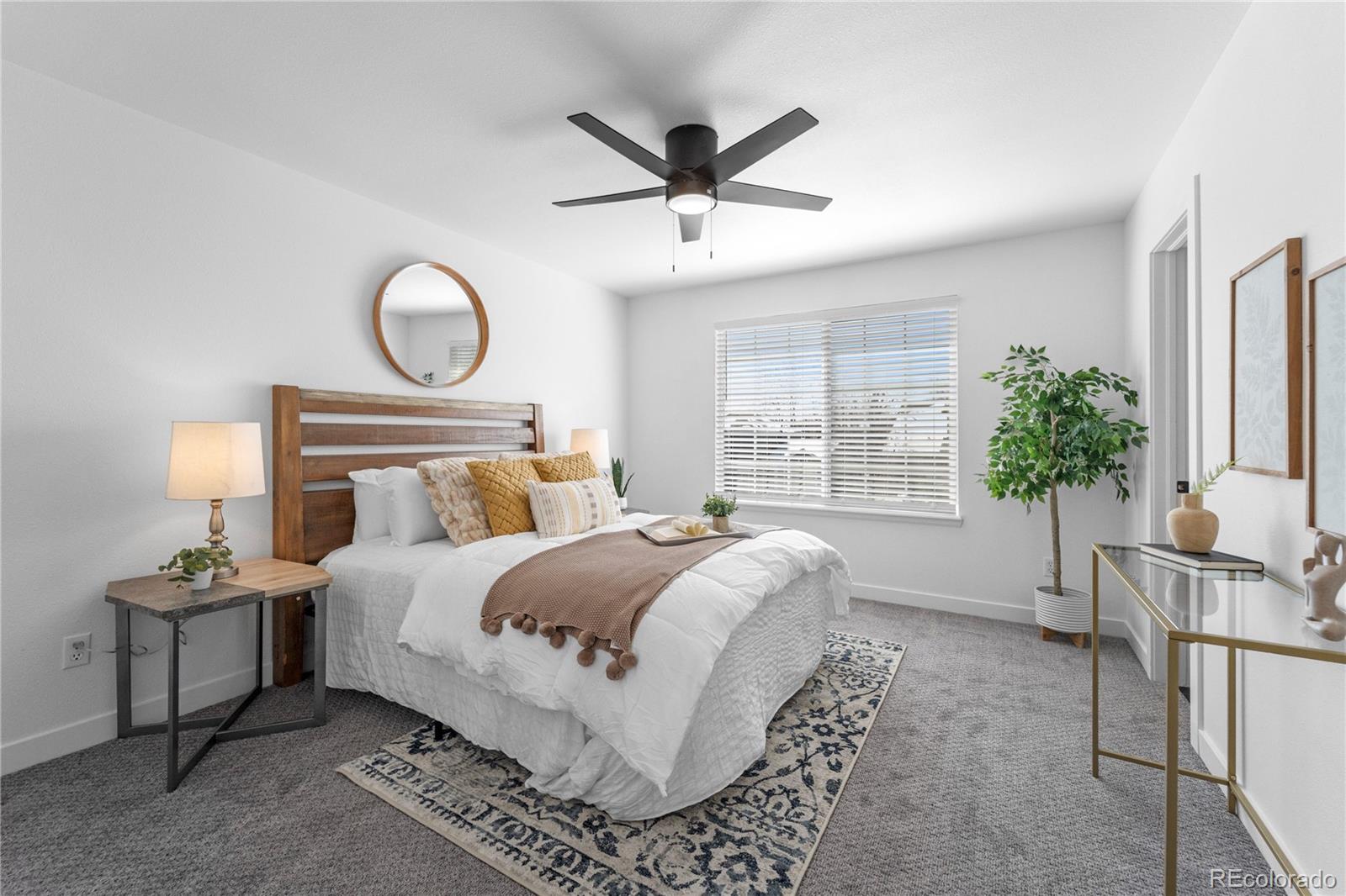 4865 Apollo Bay Drive Highlands Ranch, CO 80130 - Photo 20 of 38 a bedroom with bed and window