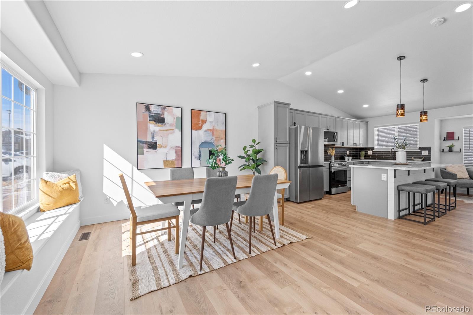 4865 Apollo Bay Drive Highlands Ranch, CO 80130 - Photo 3 of 38 a view of a dining room with furniture and wooden floor