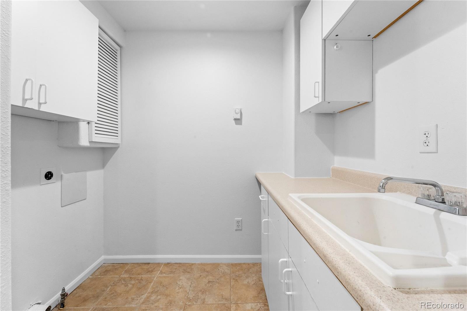 4865 Apollo Bay Drive Highlands Ranch, CO 80130 - Photo 31 of 38 a bathroom with a sink and cabinets
