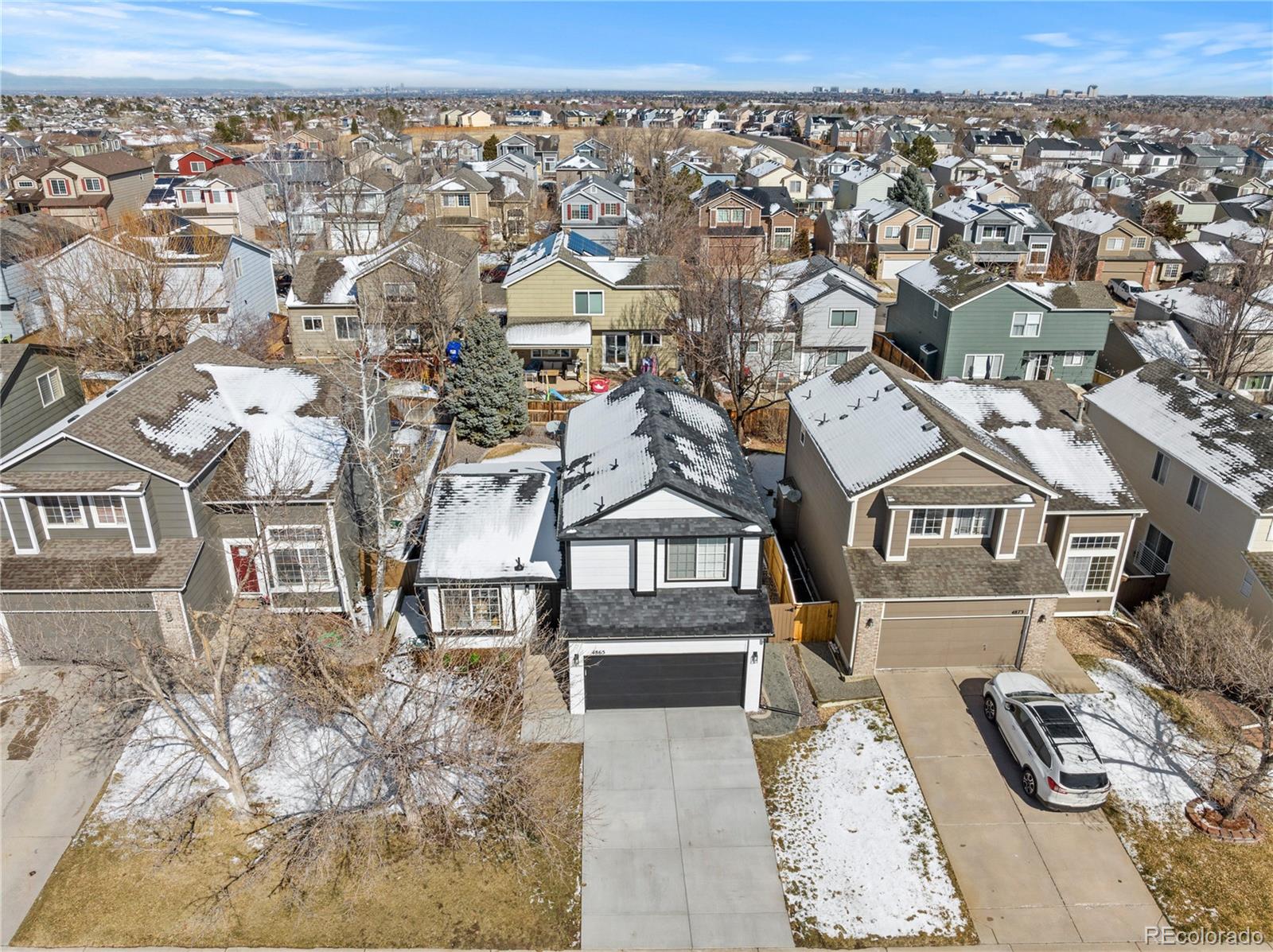 4865 Apollo Bay Drive Highlands Ranch, CO 80130 - Photo 34 of 38 an aerial view of a house with a yard