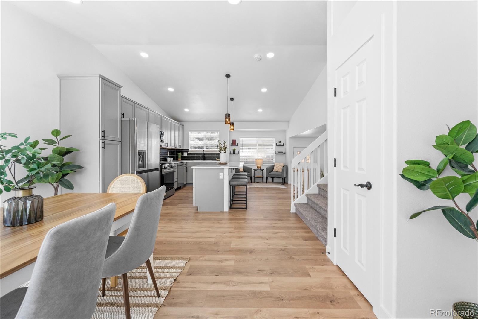 4865 Apollo Bay Drive Highlands Ranch, CO 80130 - Photo 5 of 38 a dining room with furniture and wooden floor
