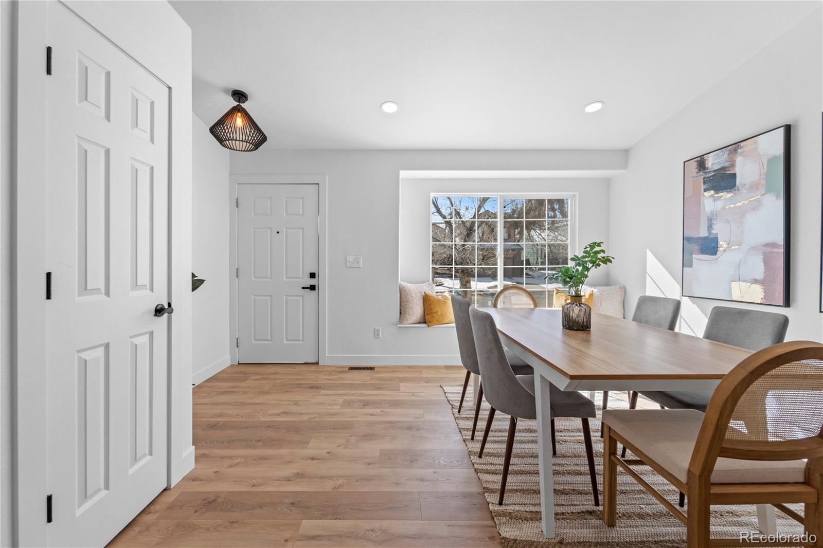 4865 Apollo Bay Drive Highlands Ranch, CO 80130 - Photo 6 of 38 a view of a dining room with furniture window and outside view