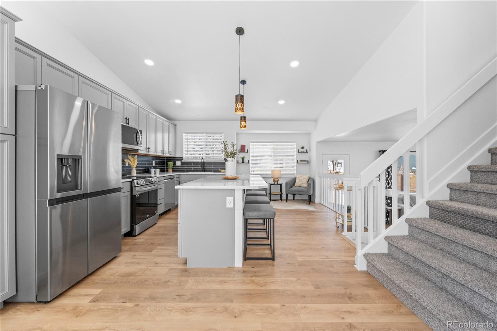 4865 Apollo Bay Drive Highlands Ranch, CO 80130 - Photo 8 of 38 a kitchen with cabinets and stainless steel appliances