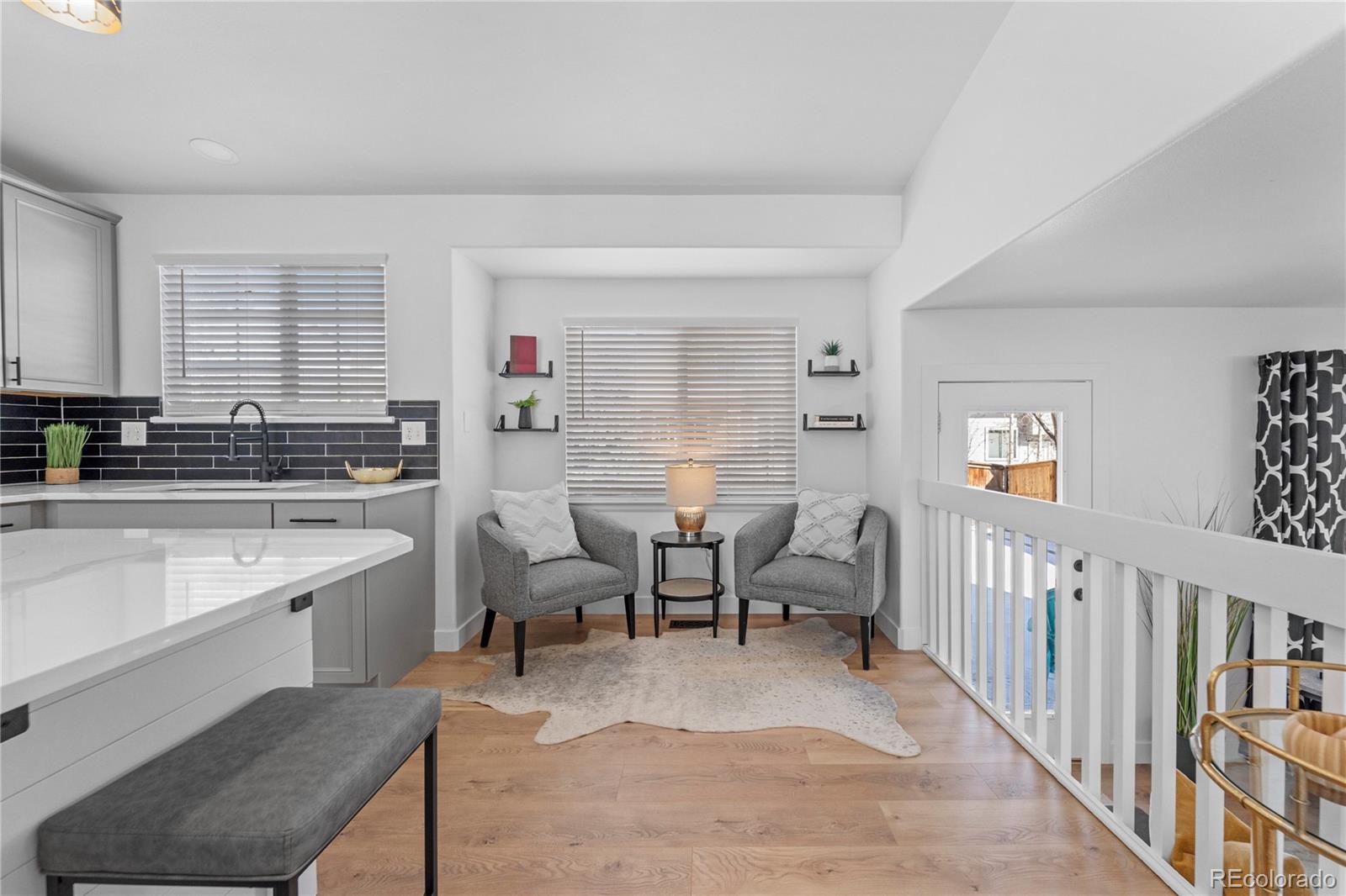 4865 Apollo Bay Drive Highlands Ranch, CO 80130 - Photo 10 of 38 a view of a kitchen with dining table and chairs