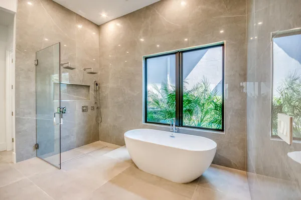 a bathroom with a tub and shower