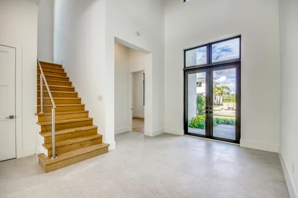 a view of an entryway with wooden floor