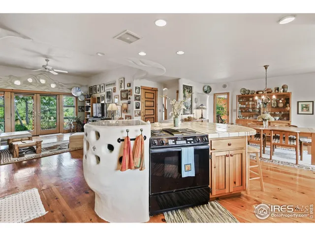 a kitchen with stainless steel appliances granite countertop a stove and cabinets