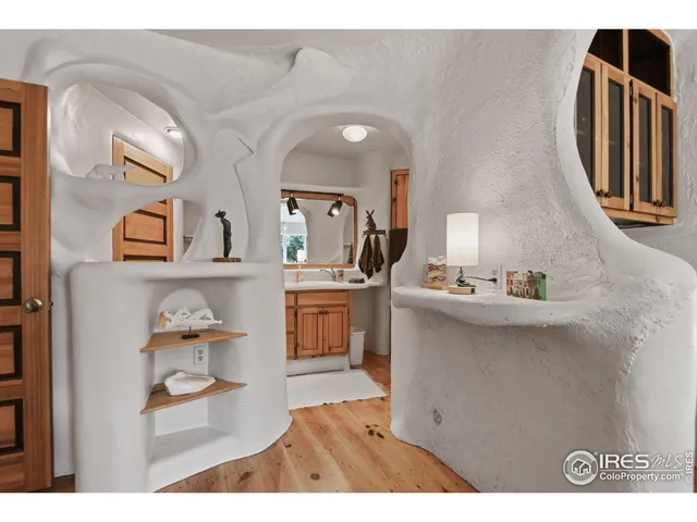 a bathroom with a sink a mirror and cabinets