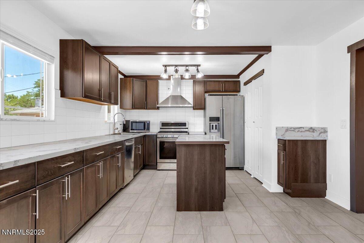 1340 Rayburn Drive Reno, NV 89503 - Photo 12 of 42 a kitchen with a sink refrigerator and cabinets