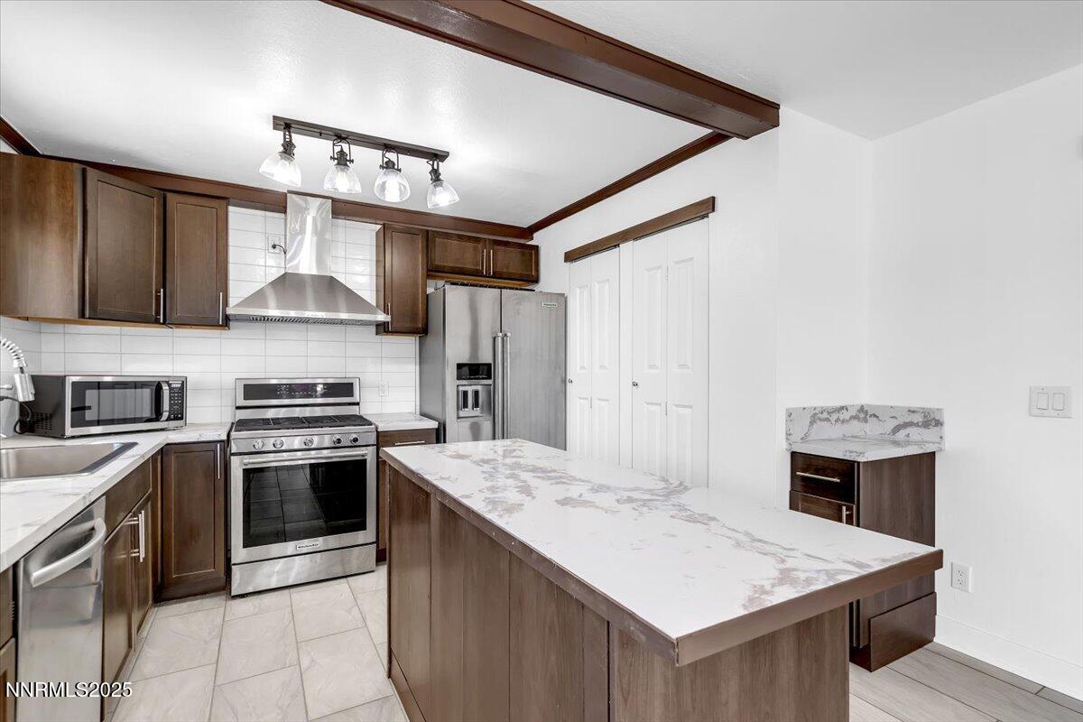 1340 Rayburn Drive Reno, NV 89503 - Photo 15 of 42 a kitchen with a stove sink and refrigerator