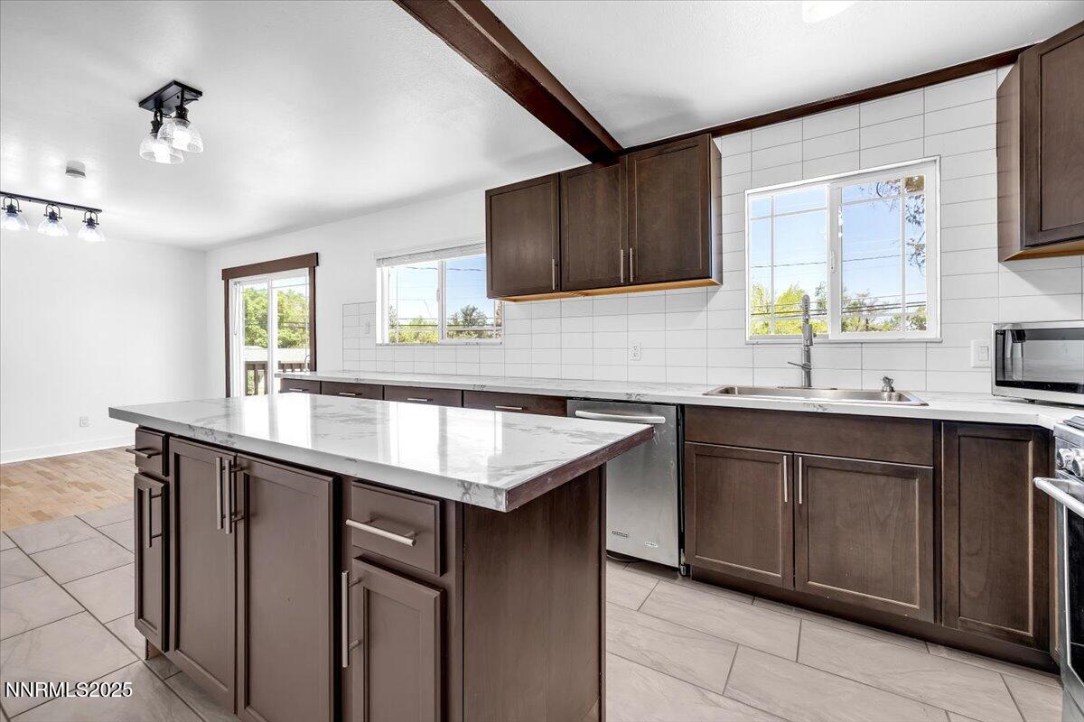 1340 Rayburn Drive Reno, NV 89503 - Photo 18 of 42 a kitchen with granite countertop a sink and cabinets