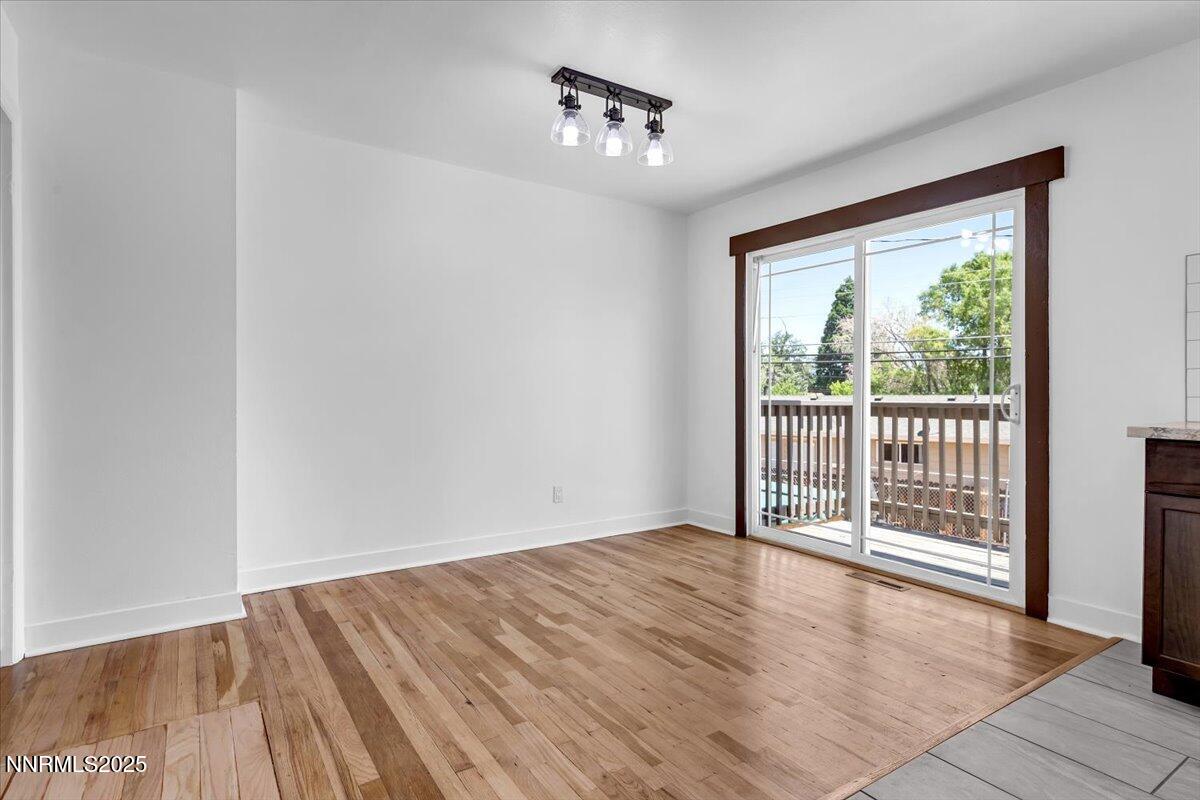1340 Rayburn Drive Reno, NV 89503 - Photo 19 of 42 a view of a room with wooden floor and a ceiling fan
