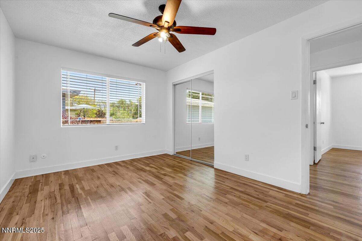 1340 Rayburn Drive Reno, NV 89503 - Photo 22 of 42 wooden floor in an empty room with a window