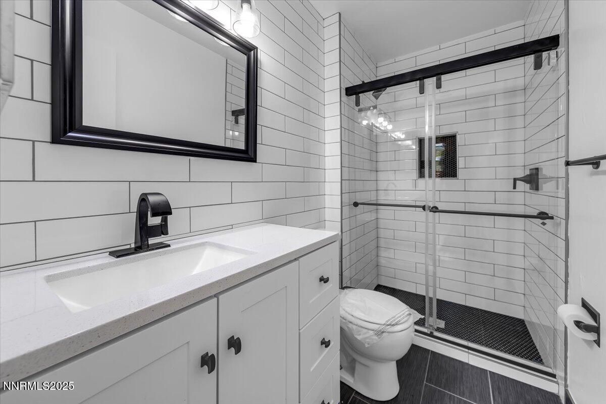 1340 Rayburn Drive Reno, NV 89503 - Photo 23 of 42 a bathroom with a sink a toilet and shower