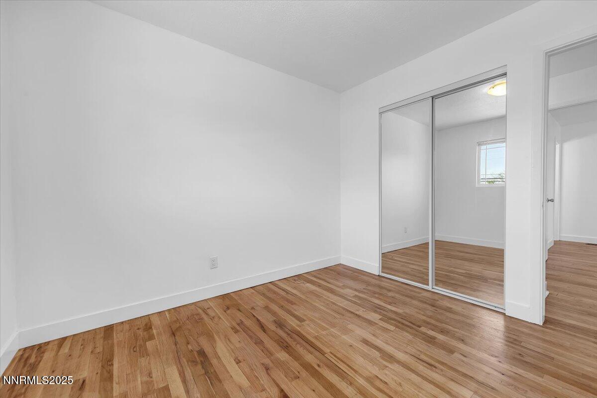 1340 Rayburn Drive Reno, NV 89503 - Photo 25 of 42 a view of empty room with wooden floor