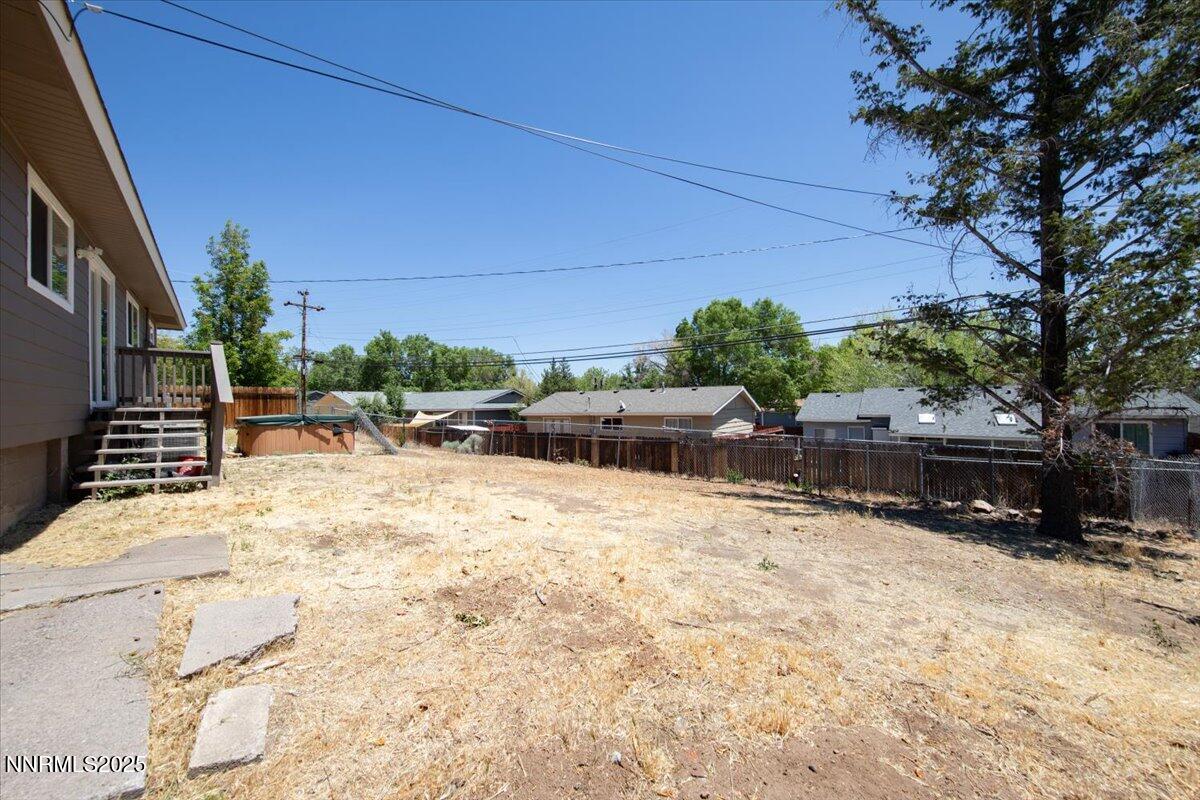 1340 Rayburn Drive Reno, NV 89503 - Photo 34 of 42 a backyard of a house with cars parked on road