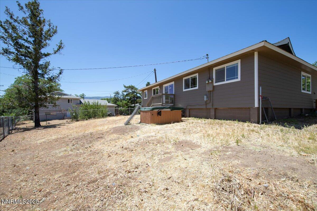 1340 Rayburn Drive Reno, NV 89503 - Photo 36 of 42 a front view of a house with a yard covered in snow