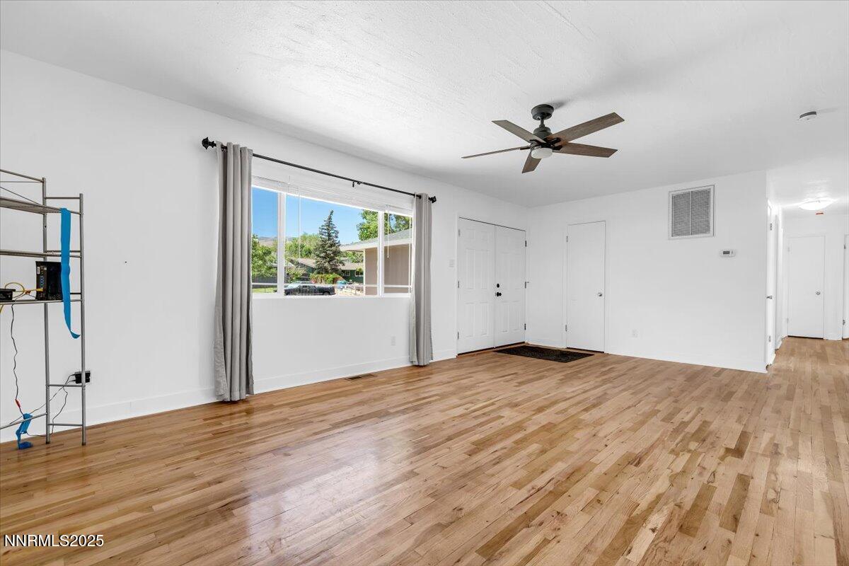 1340 Rayburn Drive Reno, NV 89503 - Photo 5 of 42 wooden floor in an empty room with a window