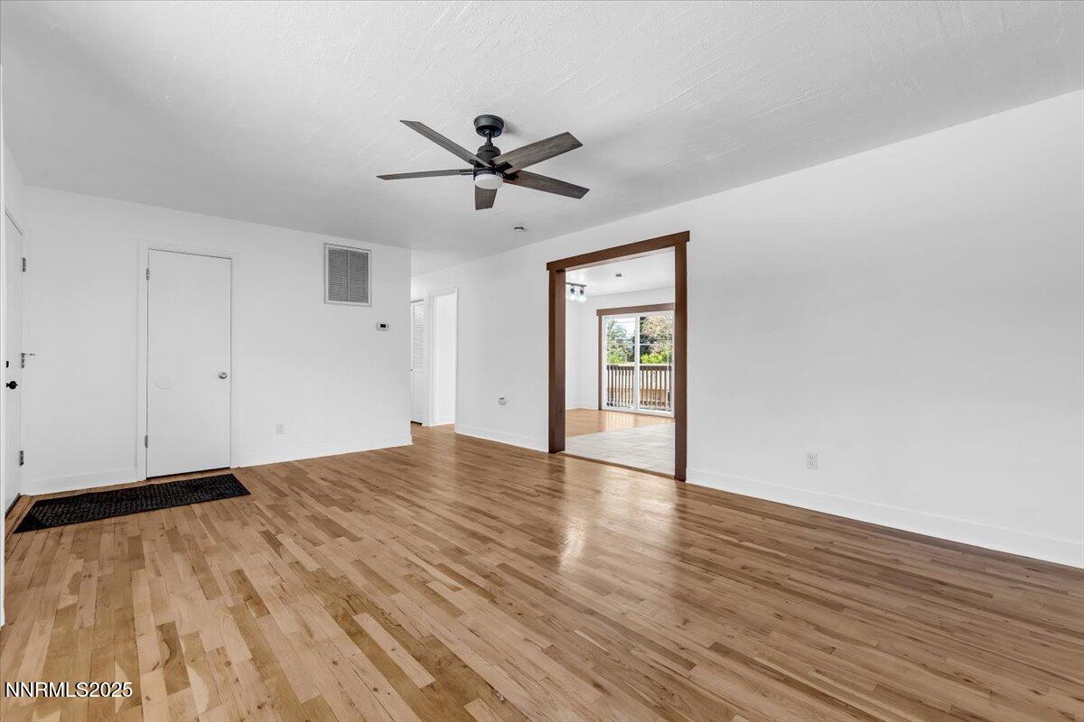 1340 Rayburn Drive Reno, NV 89503 - Photo 7 of 42 a view of empty room with wooden floor and fan