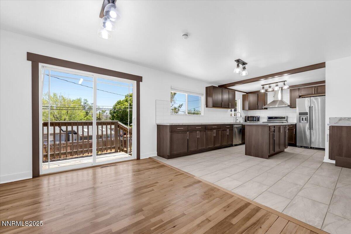 1340 Rayburn Drive Reno, NV 89503 - Photo 9 of 42 a kitchen with stainless steel appliances a stove top oven and a refrigerator