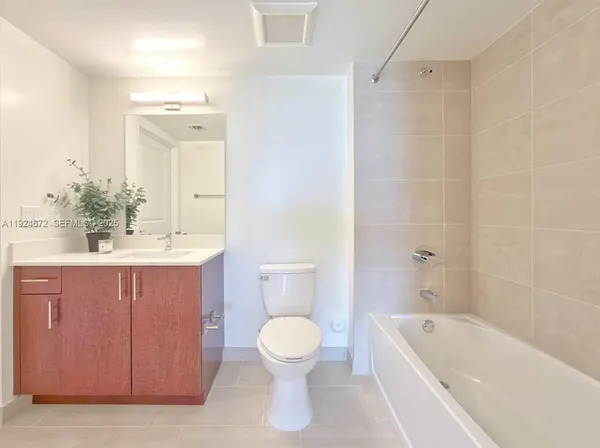 a bathroom with a sink a toilet and a bathtub