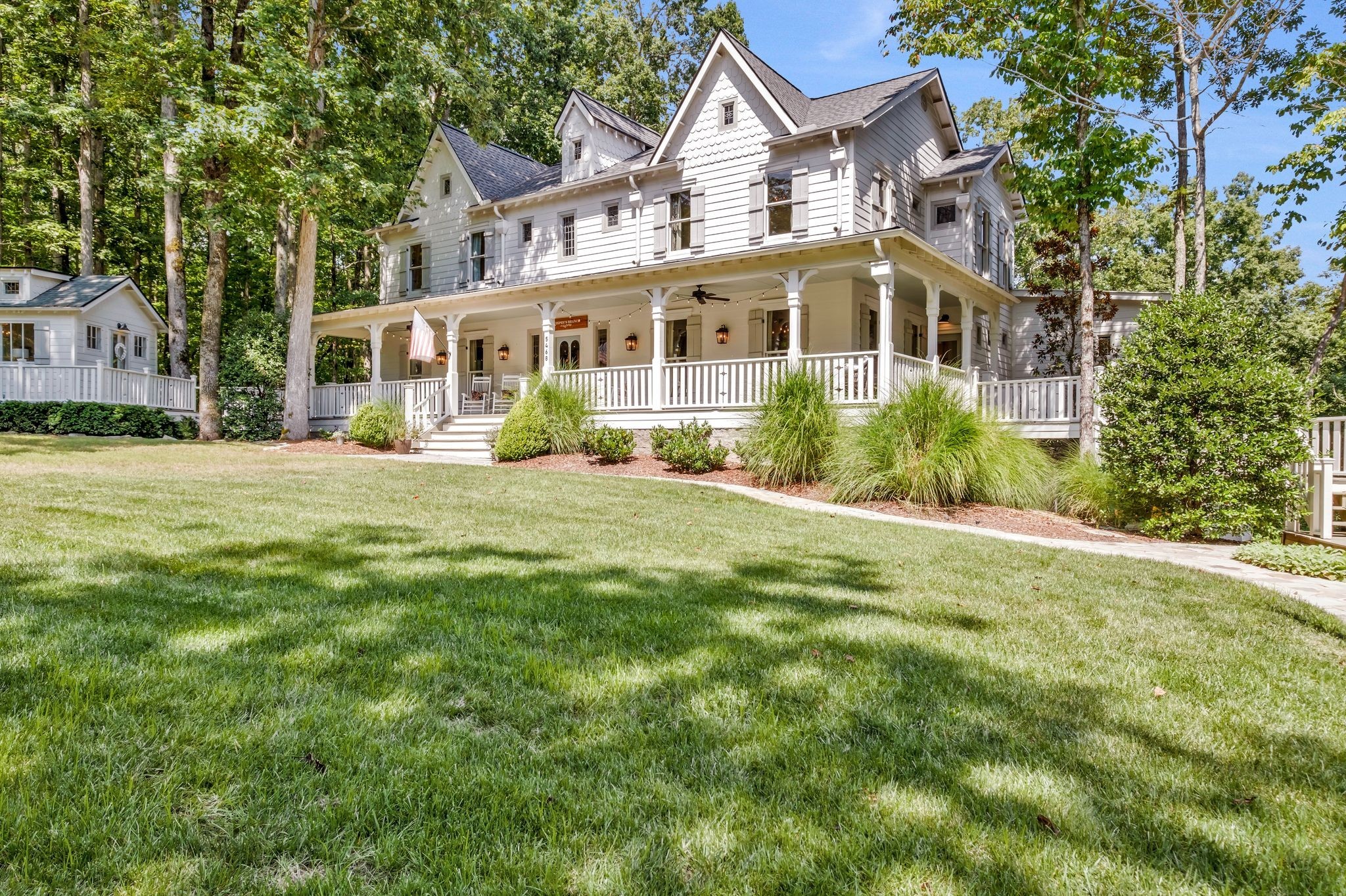 a front view of a house with a garden